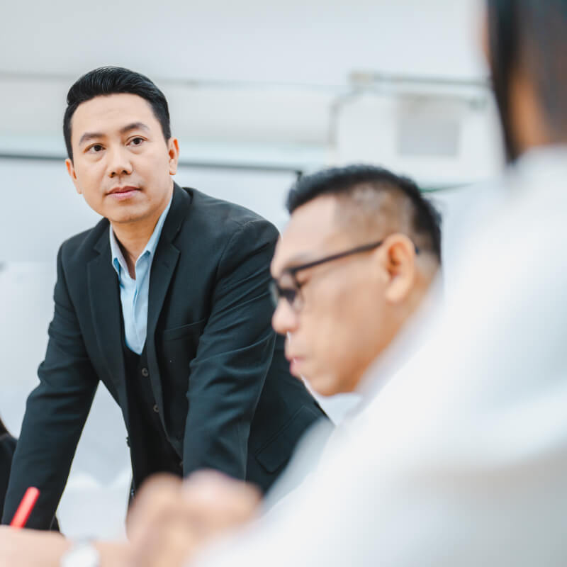 diverse business men in an office meeting